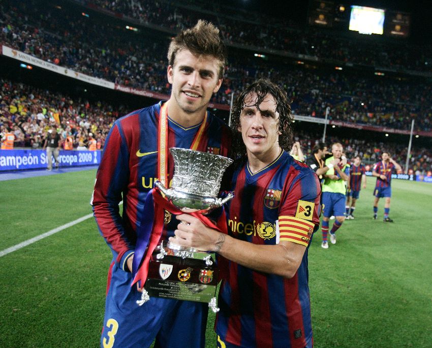 Piqué y Puyol celebrando un título del Barcelona
