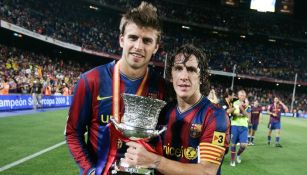 Piqué y Puyol celebrando un título del Barcelona
