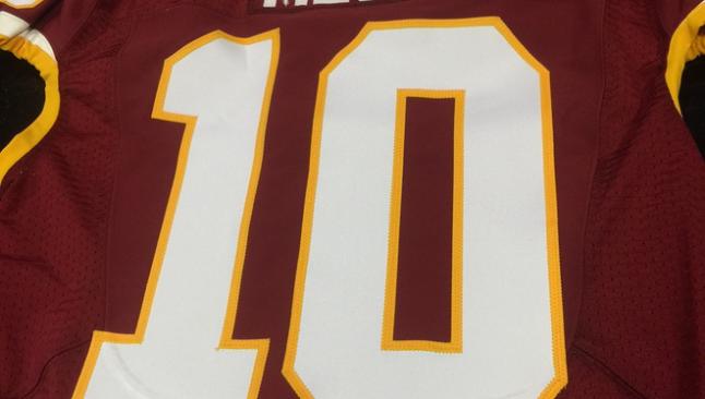 LOOK: Robert Griffin III presents Lionel Messi with Redskins