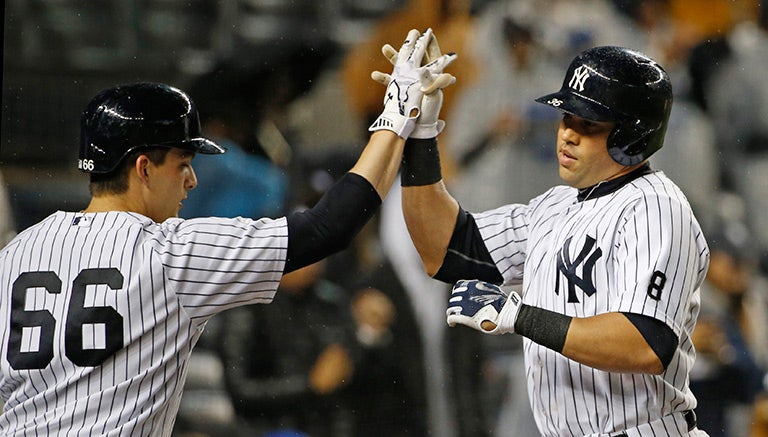 John Ryan Murphy y Carlos Beltran, durante el partido contra Boston