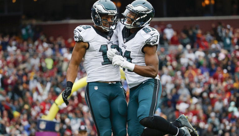 Miles Austin festeja un touchdown con Jordan Matthews