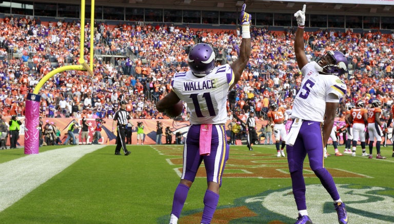 Wallace y Bridgewater festejan un touchdown