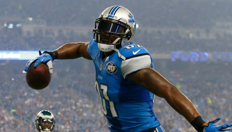 Calvin Johnson celebra uno de sus tres touchdowns