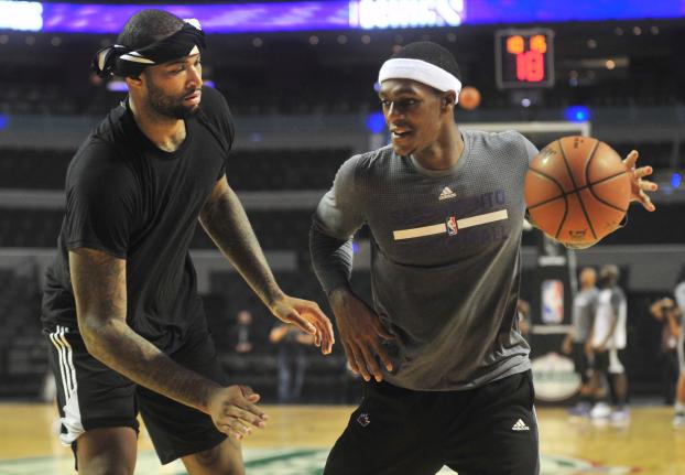 DeMarcus Cousins y Rajon Rondo, en práctica