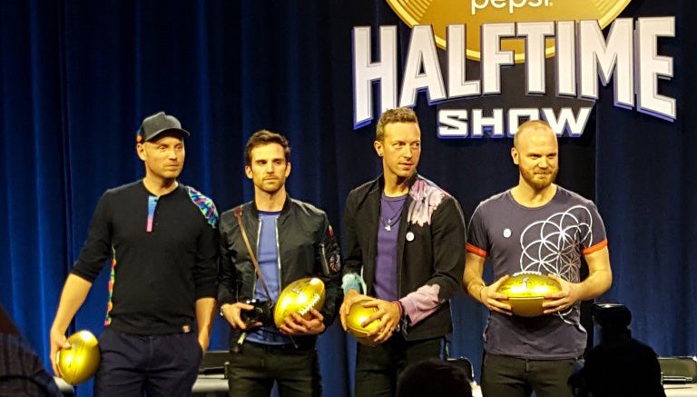 Integrantes de Coldplay, durante la conferencia de prensa del Half Time Show