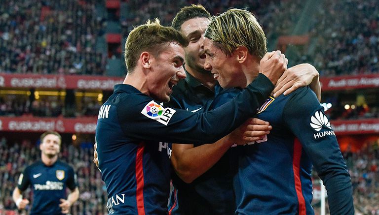 Torres, Griezmann y Koke celebran el gol del triunfo sobre Athletic