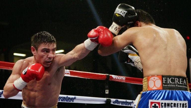 Jorge Arce y Jhonny González durante una pelea en 2014