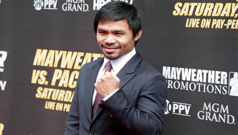 El boxeador Manny Pacquiao posando durante una promoción de la pelea entre el filipino y Mayweather