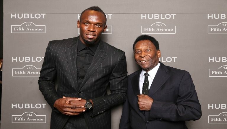 Usain Bolt y Pelé durante una celebración