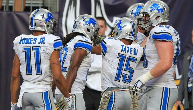 Golden Tate celebra con sus compañeros el TD del triunfo