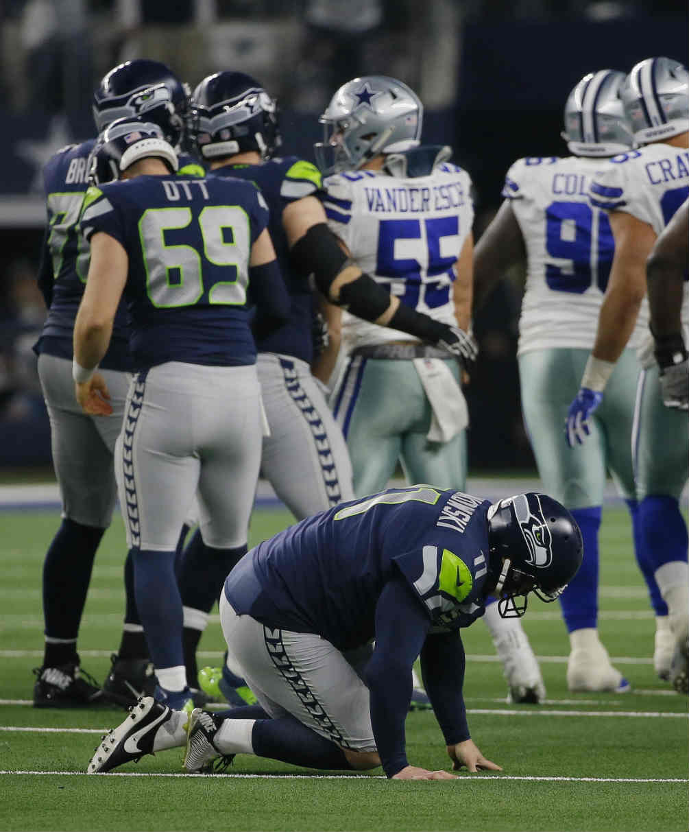 Sesbastian Janikowski lesionado durante el juego vs Dallas