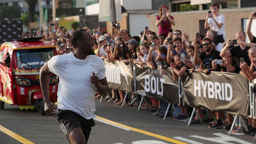 Usain Bolt corre contra el Mototaxi