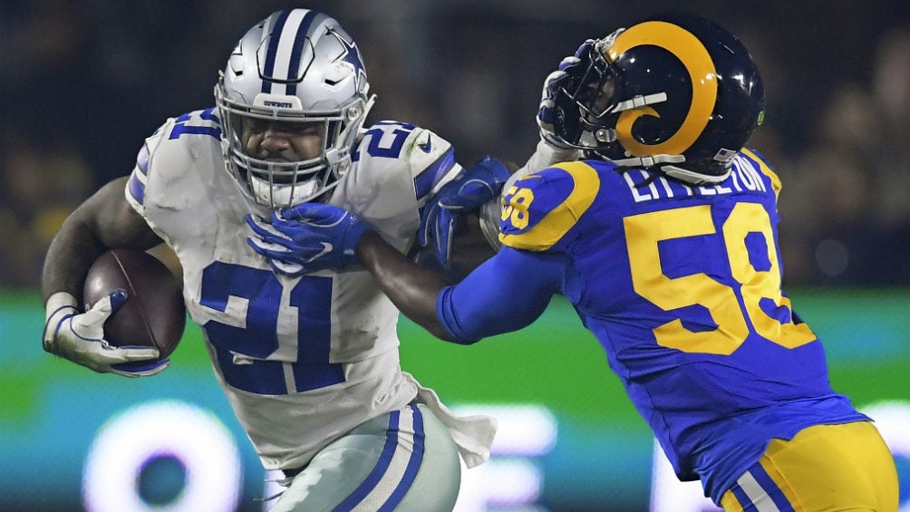 Ezekiel Elliott acarrea el ovoide en choque contra los Rams