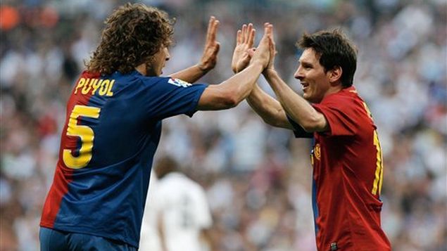 Puyol y Messi en un partido con Barcelona