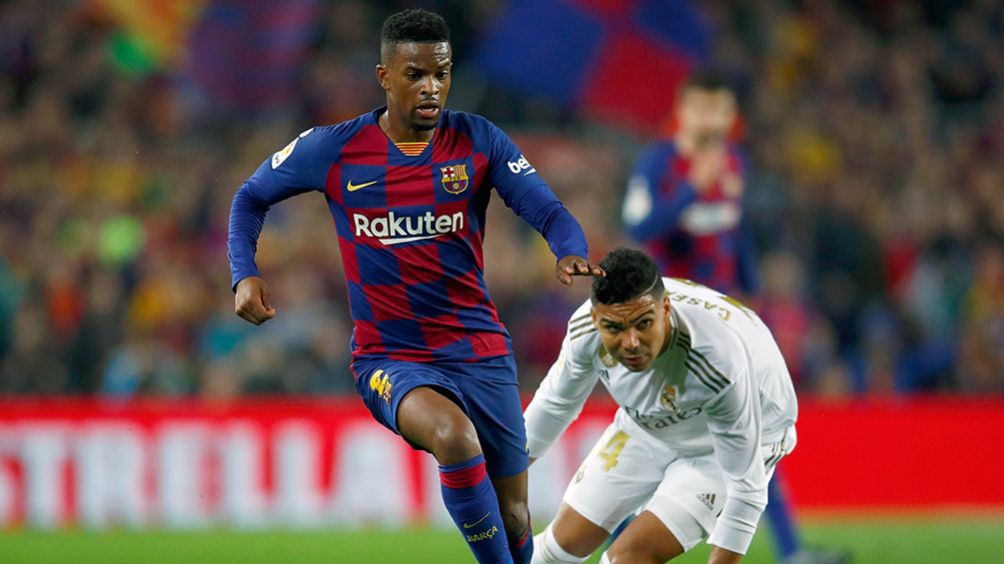 Semedo disputa un balón con Casemiro