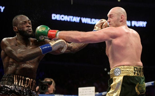 Deontay Wilder y Tyson Fury durante la primera pelea