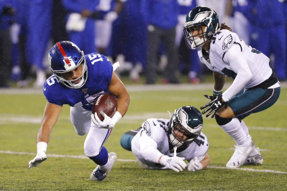 Golden Tate es derribado por Nate Gerry