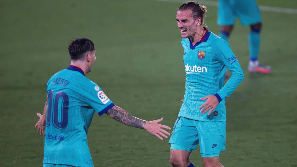 Messi y Griezmann en celebración con Barcelona