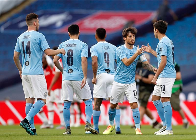 Jugadores del Manchester City en el duelo ante el Arsenal 