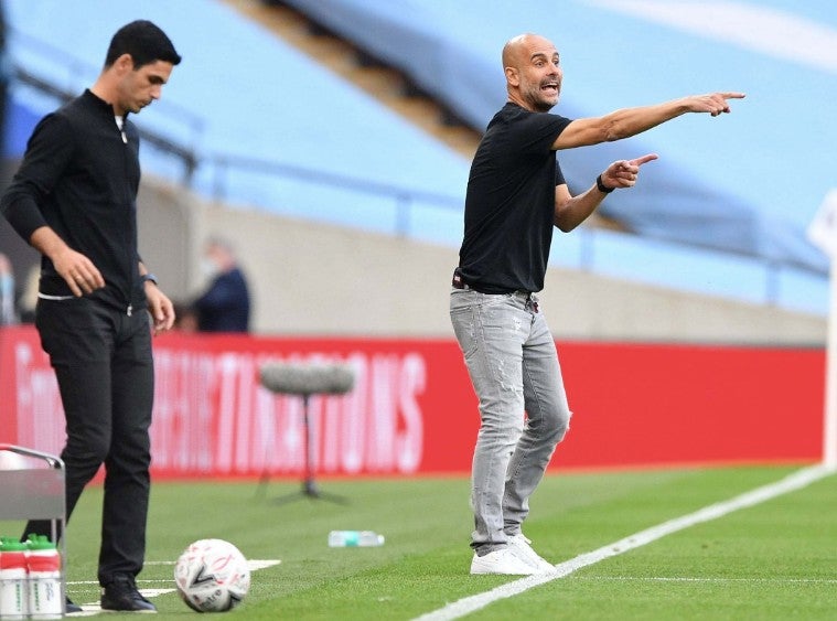 Mikel Arteta y Guardiola en un partido de la Premier League 