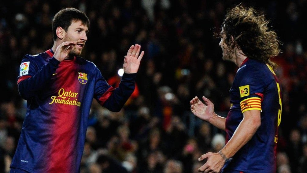 Messi y Puyol celebran gol con Barcelona