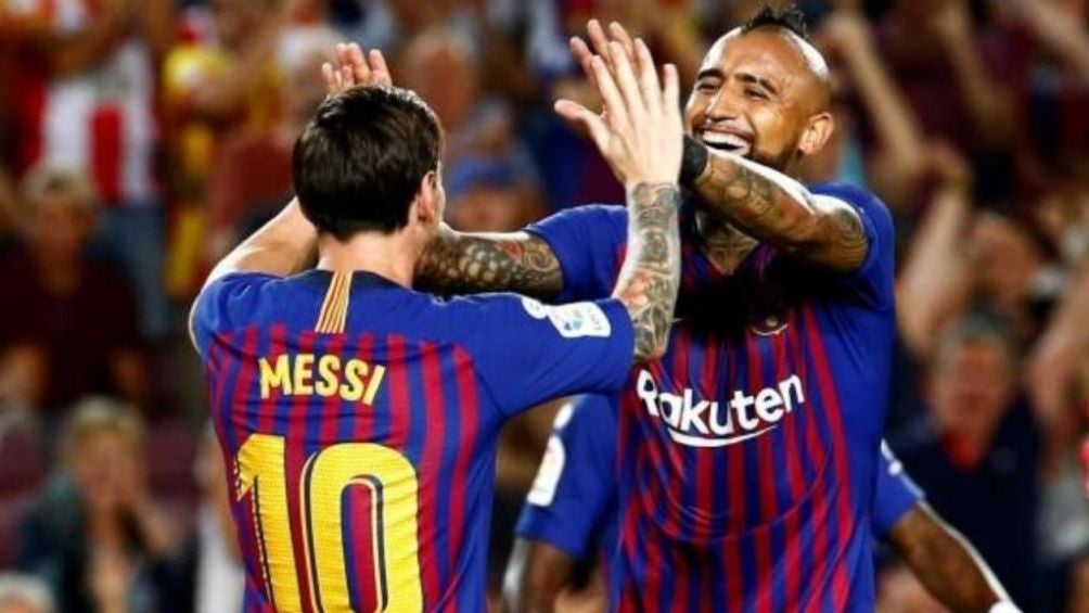 Messi y Vidal en un partido