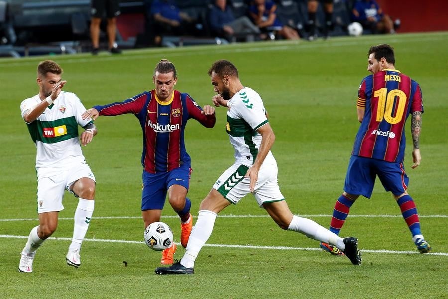 Messi y Griezmann en un partido del Barcelona