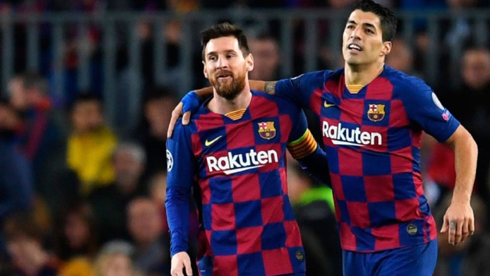 Suárez y Messi durante un duelo con el Barcelona 