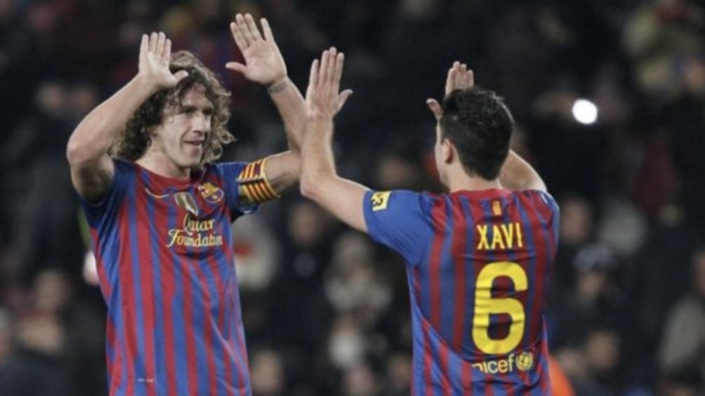 Carles Puyol y Xavi