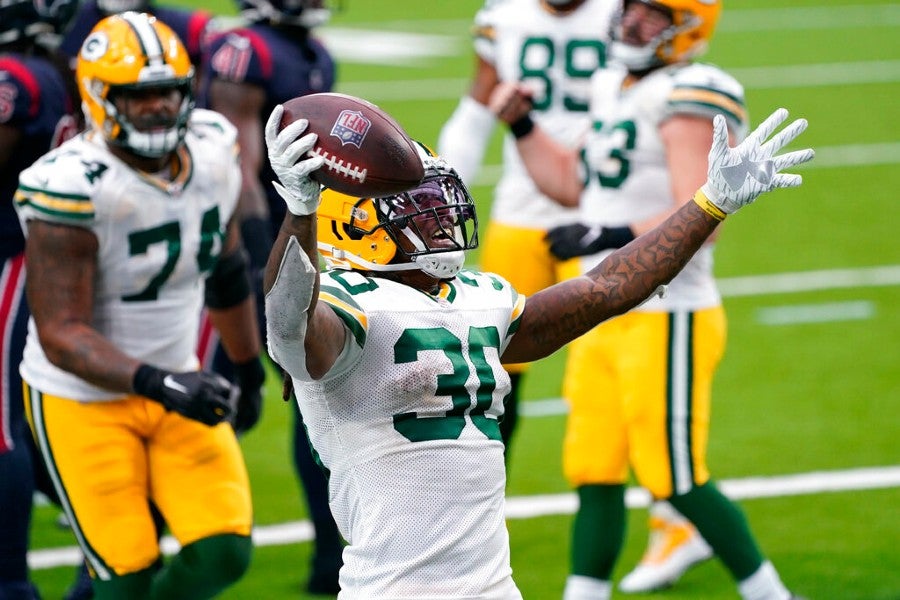 Jamaal Williams celebra tras anotar a Texans