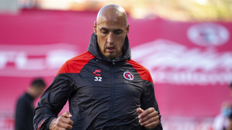 Ariel Nahuelpan con Xolos