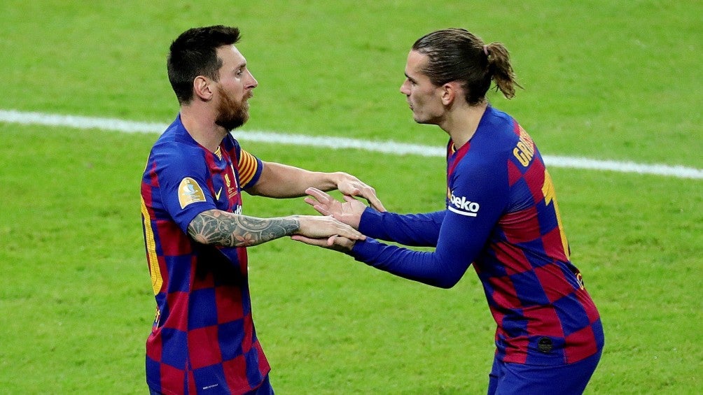 Messi y Griezmann durante un partido con Barcelona