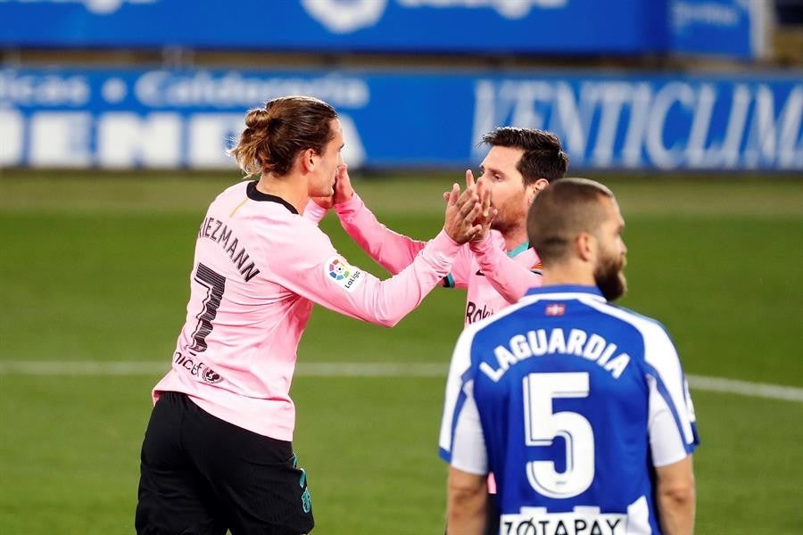 Messi y Griezmann durante un partido con Barcelona