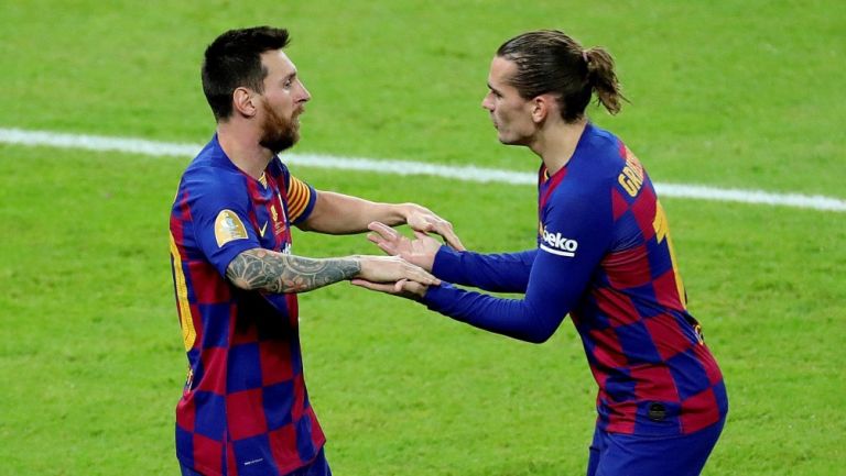 Messi y Griezmann durante un partido con Barcelona