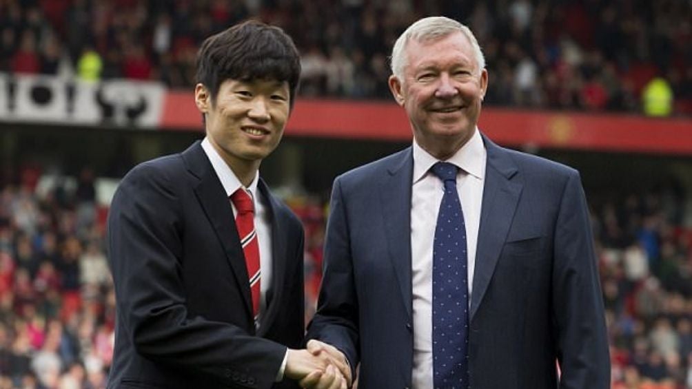 Ji Sung Park con Alex Ferguson