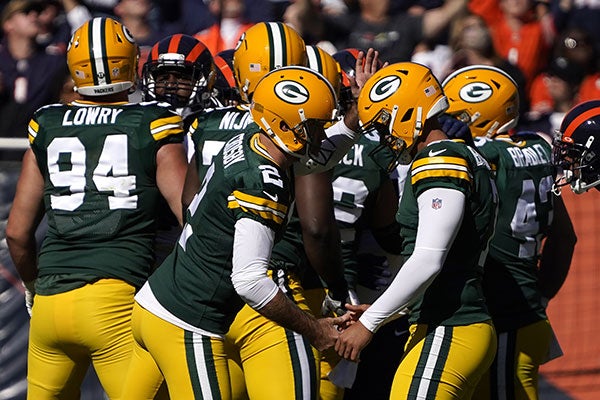 Jugadores de Green Bay festejan tras un gol de campo