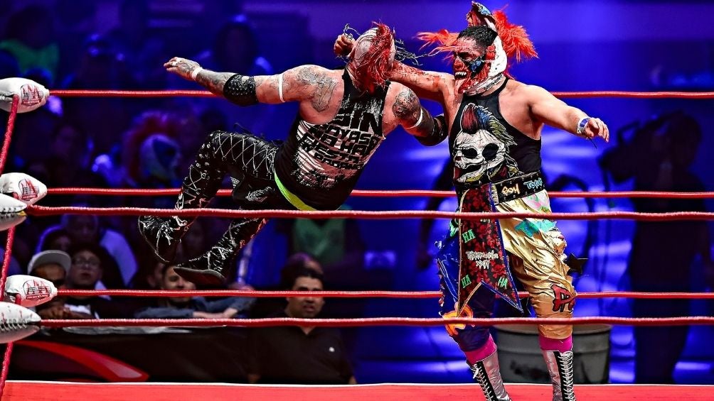 Psycho Clown y Pagano en una función 