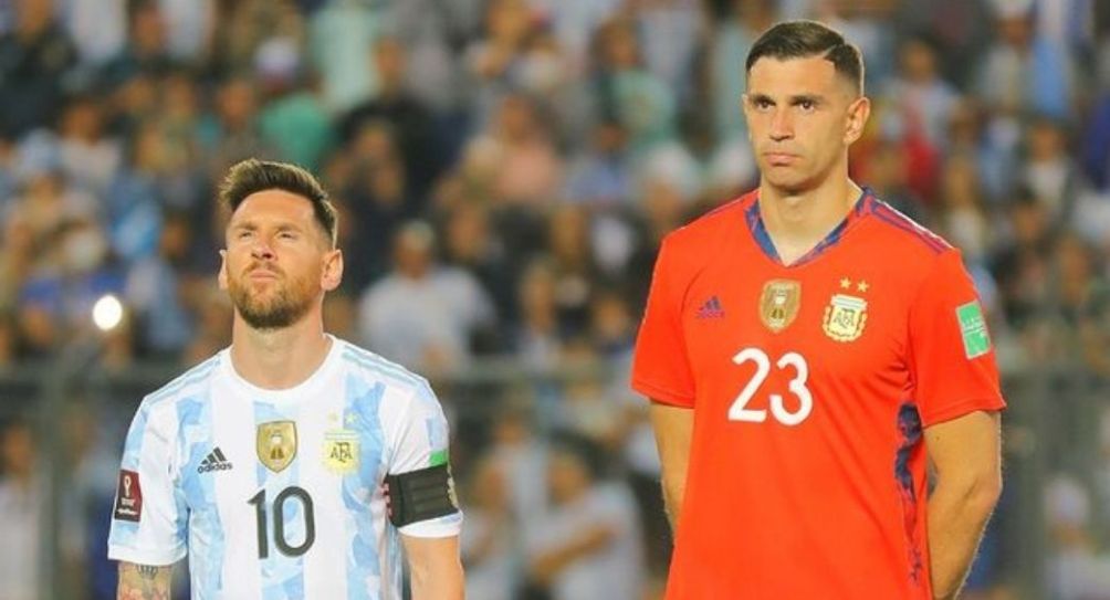 Lionel Messi y Emiliano Martínez