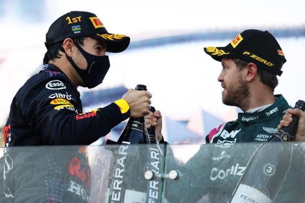 Checo y el recién retirado Vettel 