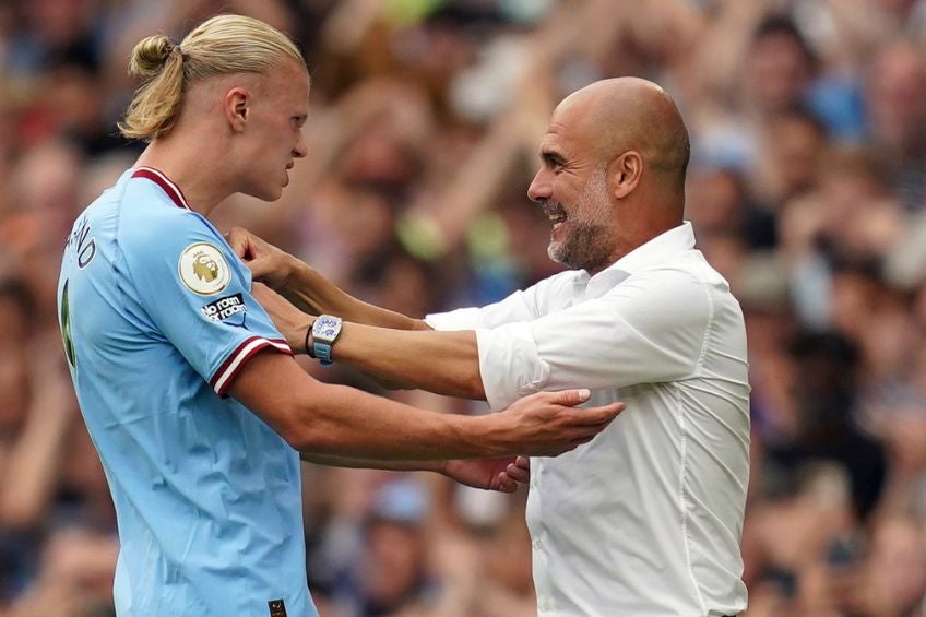 Guardiola y Haaland festejando un gol