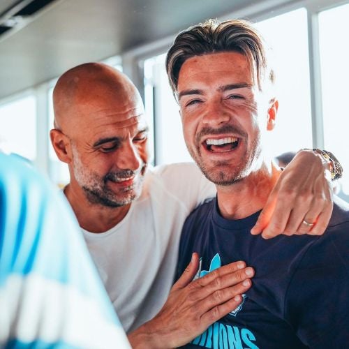 Pep Guardiola y Jack Grealish celebrando