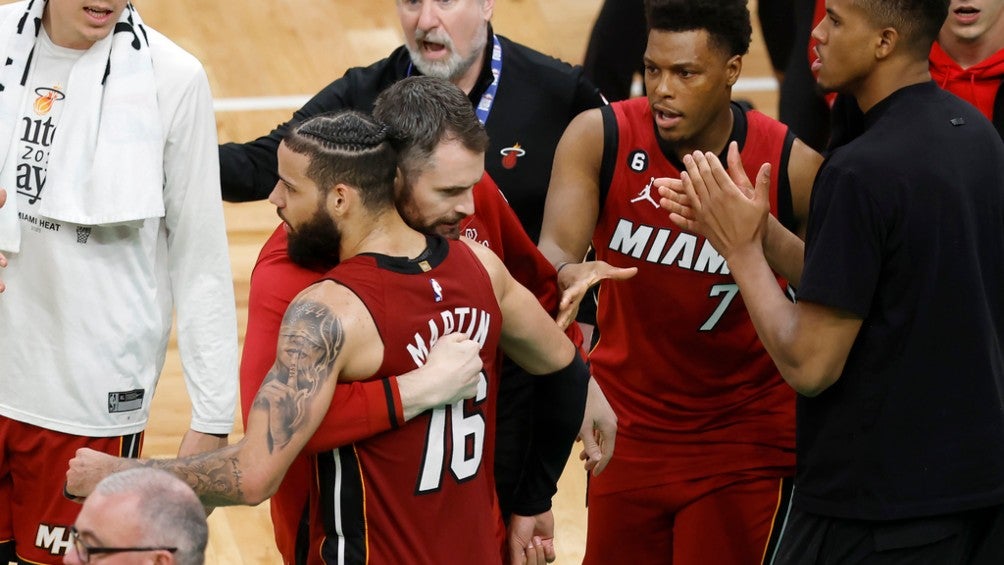 Members of the Miami Heat embrace after the second of the series