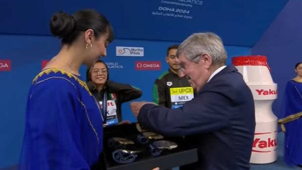 Estudillo y Berlín recibiendo sus medallas