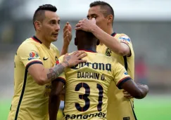 Jugadores de América festejan un gol