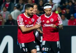 Jugadores de Xolos durante el partido contra Puebla