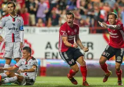 Jugadores de Xolos celebran el gol del triunfo