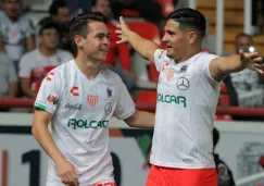 Jugadores de Necaxa celebran un gol