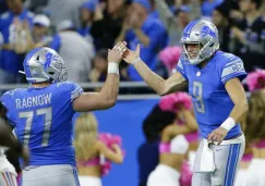 Jugadores de los Lions festejan una anotación