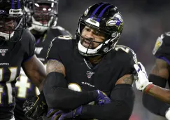 Jugadores de los Ravens festejan una jugada sobre Pats