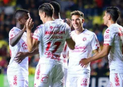 Jugadores de Xolos celebrando una anotación